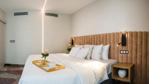 A bed or beds in a room at Verde Apartments CENTRUM