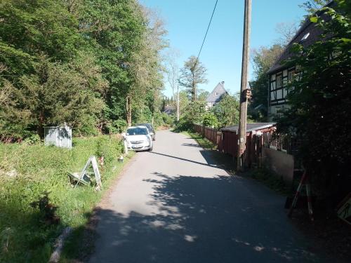 a car parked on the side of a road at Ruhig und spartanisch Wohnen im Denkmal in Lichtenwalde