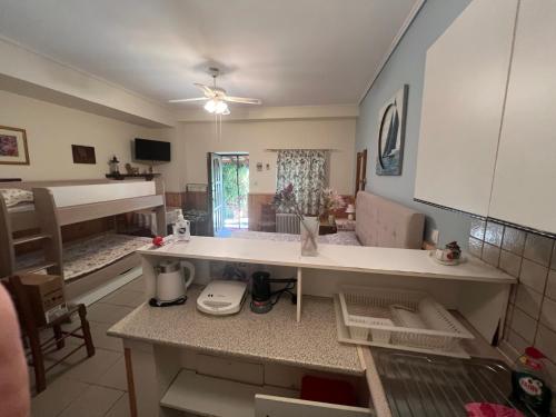 a kitchen with a counter top in a room at AFISSOS-DREAM 3STUDIOS in Afissos