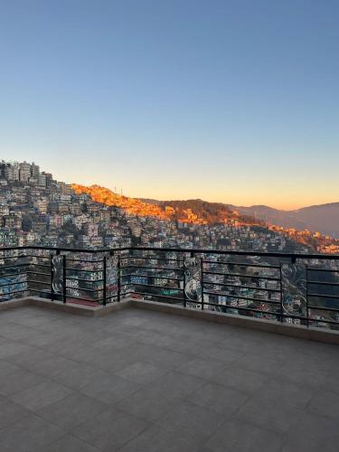 a view of a city from the top of a building at Superb Luxury Three Bed Apartment in Shimla