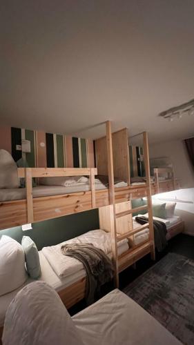 a room with three bunk beds in it at Daheim in Essen in Essen