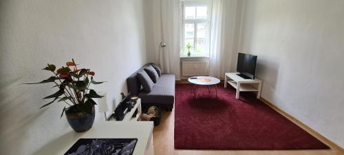 A seating area at Sunny City Apartment - Steps from Graz Main Train Station