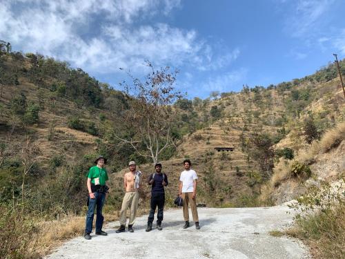 a group of people standing on a dirt road at Clan Boho in Rishīkesh