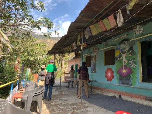 a group of people standing outside of a house at Clan Boho in Rishīkesh
