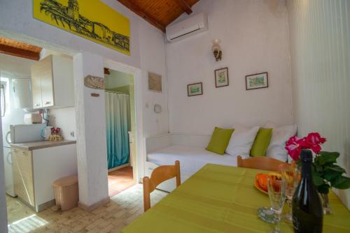 a small living room with a couch and a table at Stokic in Veli Lošinj