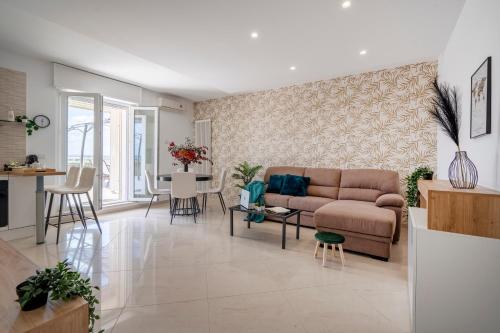 a living room with a couch and a table at White Horizon in Macchie