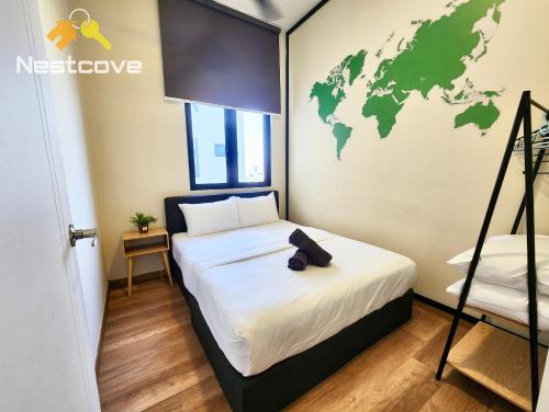 a bedroom with a bed with a world map on the wall at The Quartz Residence & Suites Infinity Pool By Nestcove in Melaka
