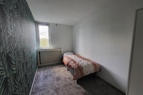 Cama o camas de una habitación en LelystadWK