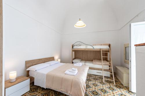 Ένα ή περισσότερα κρεβάτια σε δωμάτιο στο Casa Cenzina by Rentbeat