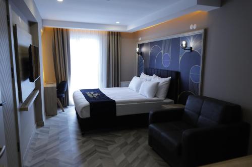 Ένα ή περισσότερα κρεβάτια σε δωμάτιο στο Iron Loft Hotel