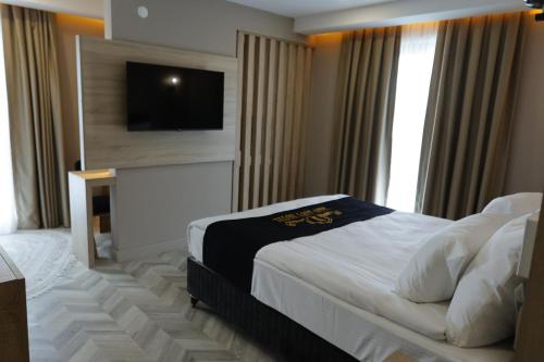 Ένα ή περισσότερα κρεβάτια σε δωμάτιο στο Iron Loft Hotel