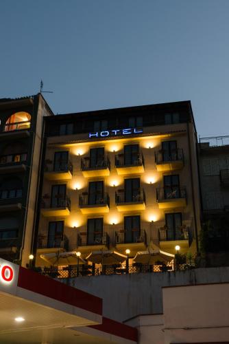 a hotel with a hotel sign on the side of it at Hotel Villa Mare in Altavilla Milicia