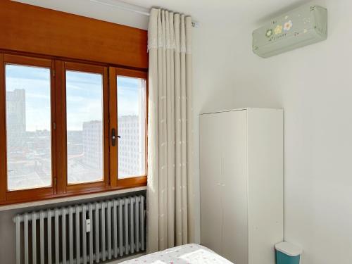 a white room with a window and a radiator at Venice mestre sweet home in Marghera