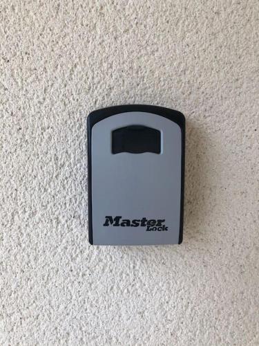 a black and white switch on a wall at Gîte “Les reflets de la Charente” in Condac