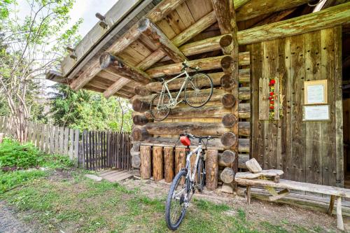 a bike parked outside of a wooden building at Ferienhaus Rauchegg - Bergblick in San Pancrazio dʼUltimo