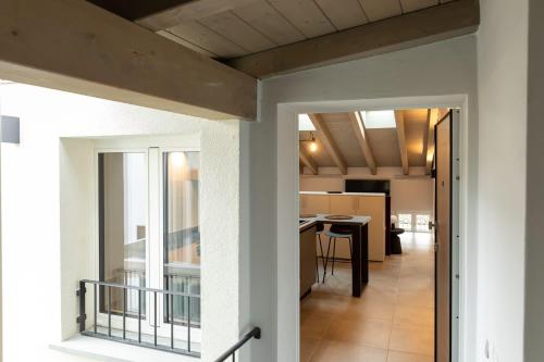 a view of the living room and kitchen of a house at Palais Bernadette in Parma