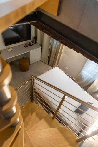 an overhead view of a room with a stair case at Palais Bernadette in Parma
