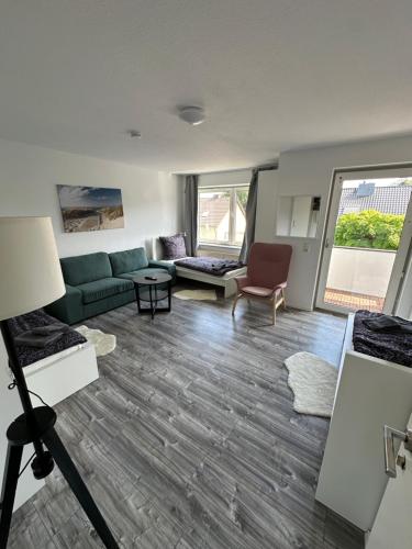 a living room with a couch and a table at Schöne Apartments in Königsdorf BM01 bis BM04 in Frechen