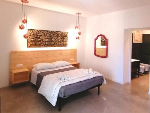 Postel nebo postele na pokoji v ubytování B&B Ibla Art Centro