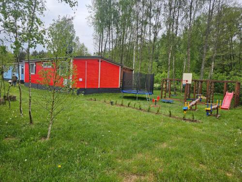 Κήπος έξω από το Domek letniskowy - żółty-całoroczny
