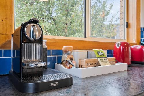 a coffee maker sitting on a counter in a kitchen at Lavender Cove in Kingston Beach