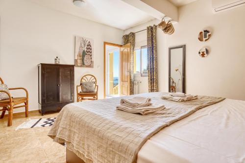 a bedroom with a bed with two towels on it at Lujosa Calpe in Calpe