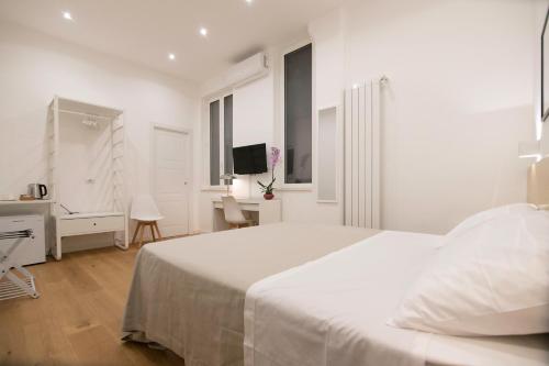 Кровать или кровати в номере Villareale47 Luxury Suites & Rooms