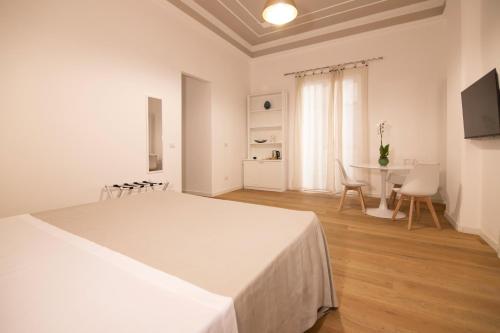 Кровать или кровати в номере Villareale47 Luxury Suites & Rooms
