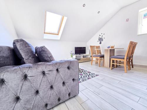 a living room with a couch and a table at Stone House Varos Apartments in Split