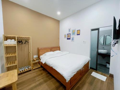 Łóżko lub łóżka w pokoju w obiekcie Măng Đen Land - Homestay&Coffee