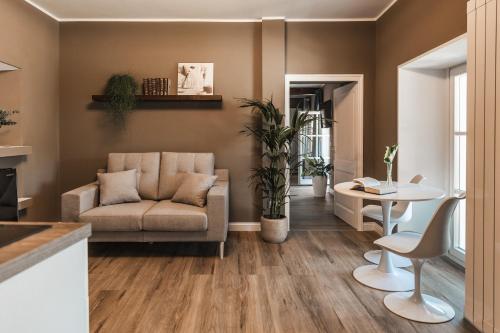 a living room with a couch and a table at Villa Antica Colonia SPA & Wellness in Pettenasco