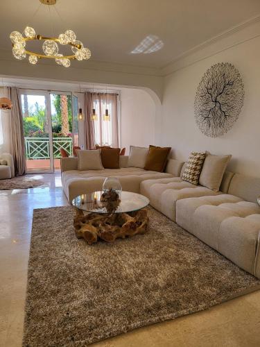 a living room with a couch and a coffee table at Oxygène in Marrakech