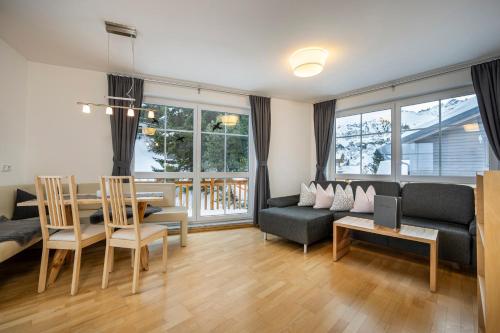 a living room with a couch and a table at Appartement Haus Faßwald in Obertauern