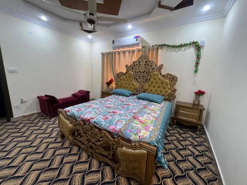 a bedroom with a large bed in a room at Home in Islamabad in Islamabad