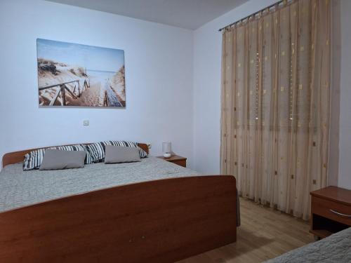 Postel nebo postele na pokoji v ubytování Rumora Ivan Apartment