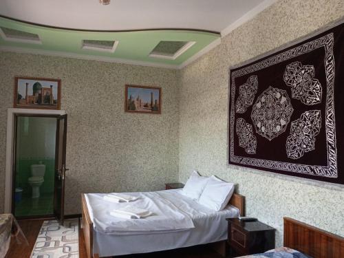 Ένα ή περισσότερα κρεβάτια σε δωμάτιο στο Sohibqiron HOSTEL
