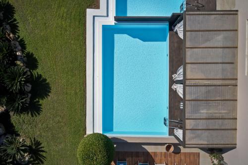 an overhead view of a swimming pool at Aquagrand Artistic Luxury Beach Resort - Adults Only in Líndos