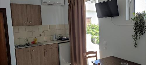 Η κουζίνα ή μικρή κουζίνα στο Maria Studios and Apartments