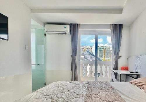 Un pat sau paturi într-o cameră la Siris Residence
