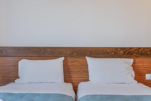 Ένα ή περισσότερα κρεβάτια σε δωμάτιο στο Creta Verano Hotel