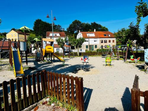 an empty playground with swings at Apartamento Exclusivo a pie de Playa in Vigo