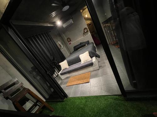 an overhead view of a bedroom with a bed at KUBU BLACK HOUSE in Jembrana