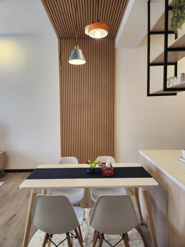 a dining room with a table and chairs at Antara Lima Homestay Putrajaya in Putrajaya