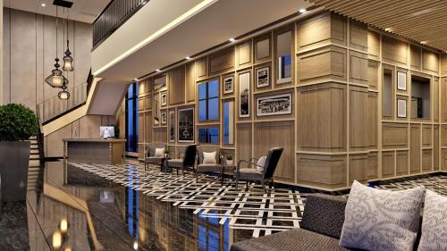a lobby with a waiting room with chairs at BW Express Jakarta Tanah Abang in Jakarta