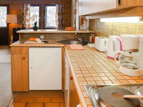 Una cocina o zona de cocina en Apartment Les Arsets 301-11 by Interhome