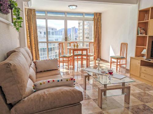 a living room with a couch and a table at Apartment Halcon Levante by Interhome in Benidorm