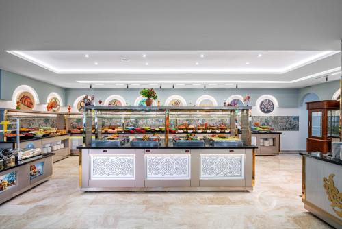 a bakery with a lot of food on display at Club Big Blue Suit Hotel - All Inclusive Plus in Alanya