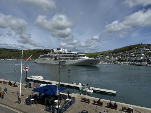 a cruise ship is docked in a harbor at Seascape - Waterfront apartment, glorious views and parking in Dartmouth