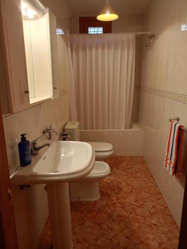a bathroom with a sink and a toilet and a shower at Casa Milagros in Mirambel