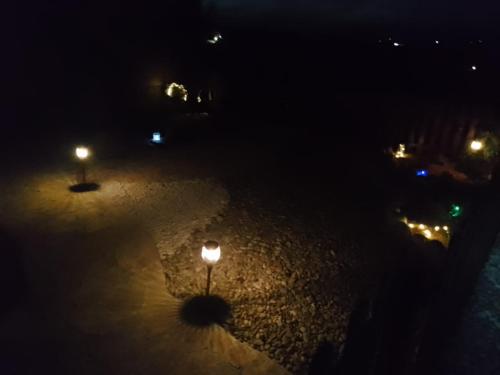 a street light in the snow at night at La casetta sotto l'albero LA CAROVANA GITANA in Vasto